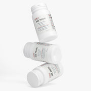 Three Jeemya Bee Pearl supplement bottles stacked at different angles on a minimalist white background, showcasing the product packaging.