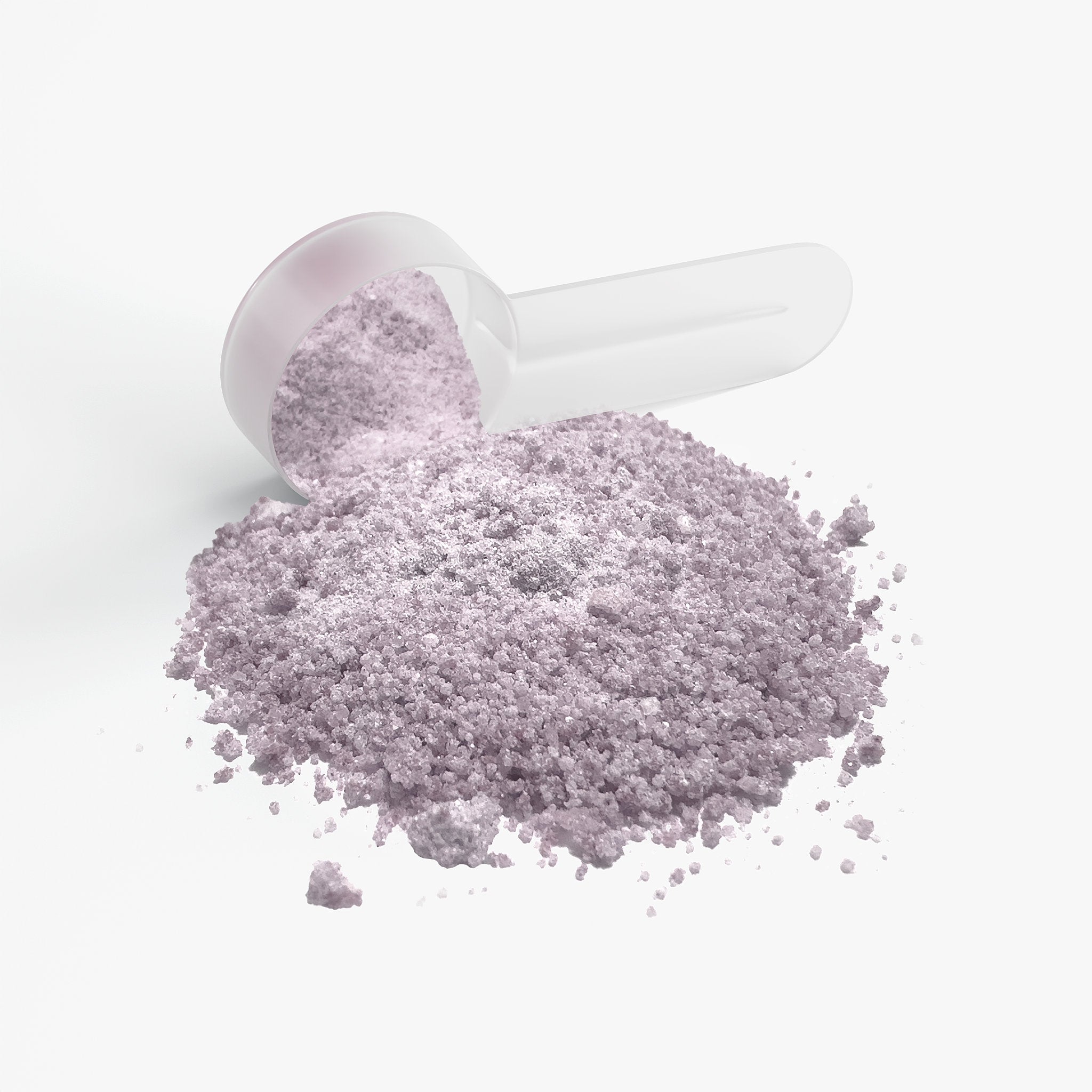 Light purple Jeemya Focus Powder spilled from a white measuring scoop on a white background, highlighting the powdered supplement texture.