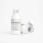 Jeemya Snail Mucin Face Serum bottle with the dropper placed beside the bottle on a minimalist white background, highlighting the serum packaging.